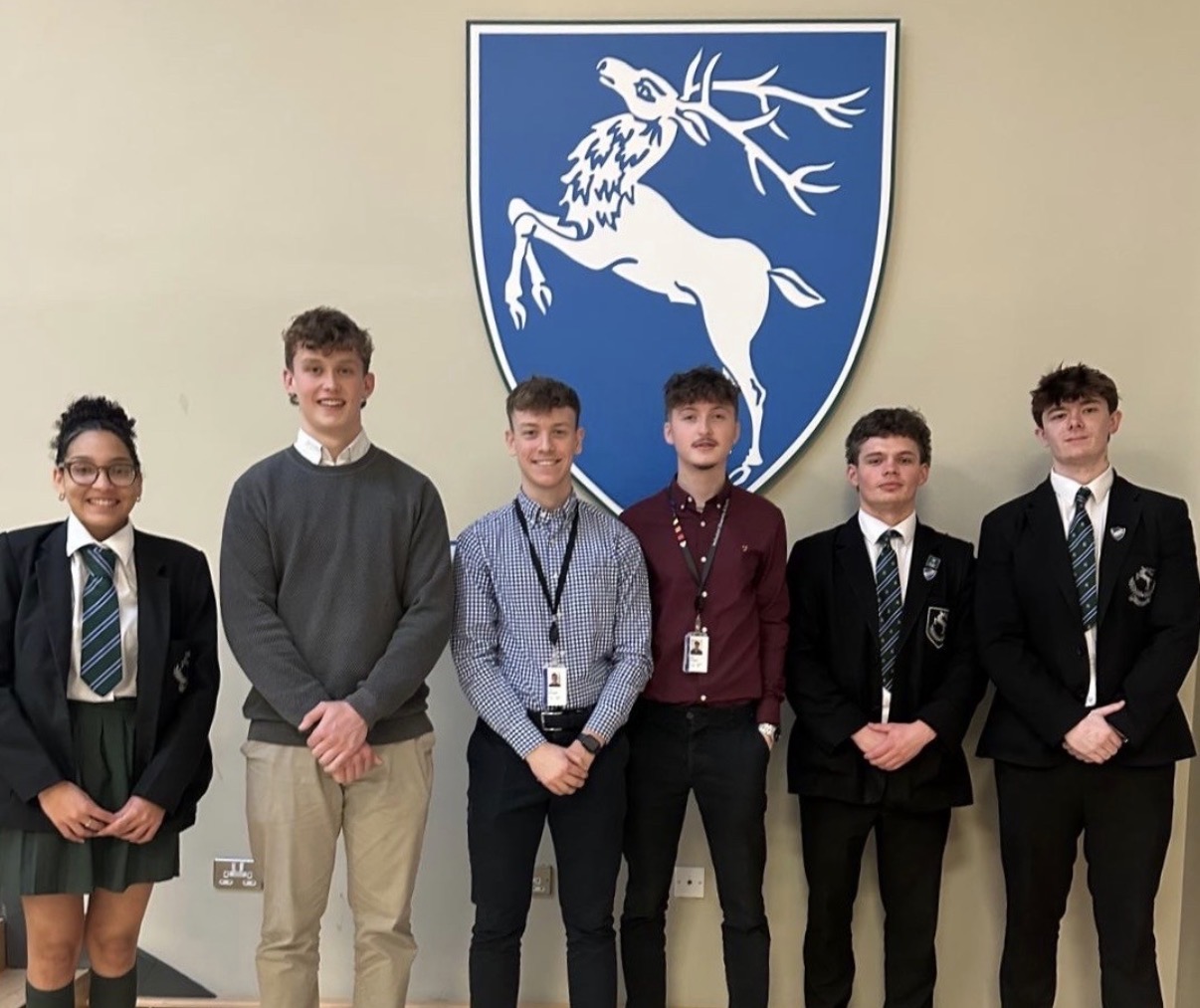 PathwayX founder Ben Glasgow with students and staff in an education setting